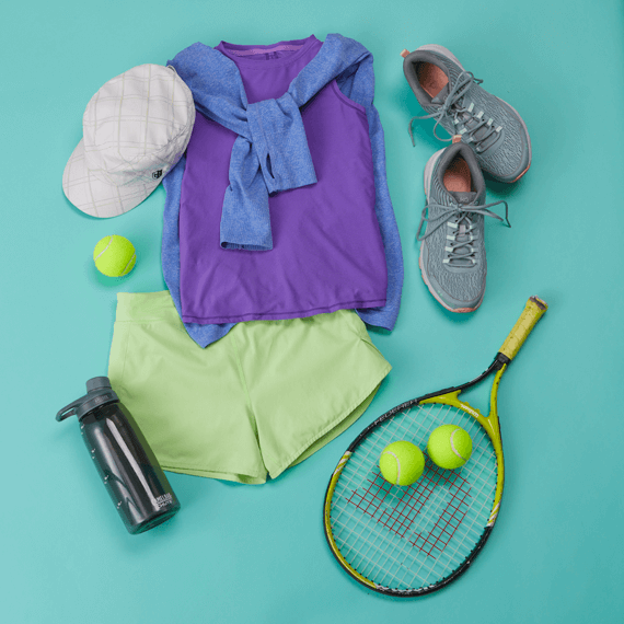 A tank top, shorts, jacket, hat, tennis shoes, a water bottle, a tennis racket and balls.