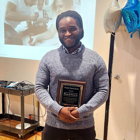 man holding an award