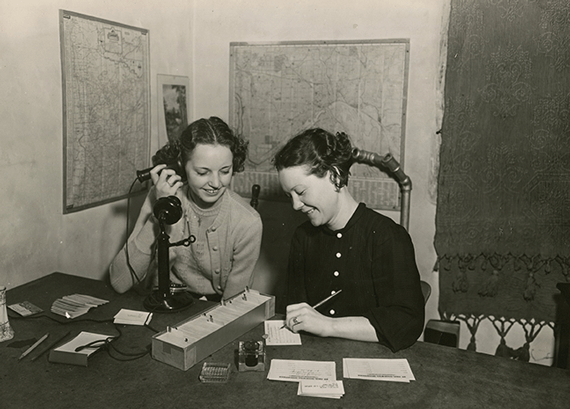 Photo of 2 women answering phone calls