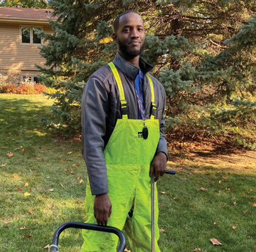 Photo of Fahad smiling at work.