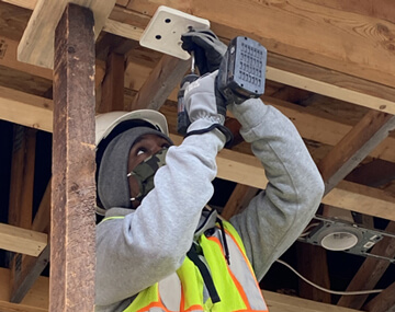 Photo of Van working on the house during his training