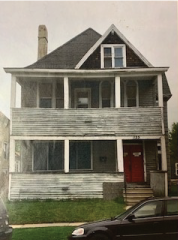 An older photo of the front facade of the Marg house before renovation.