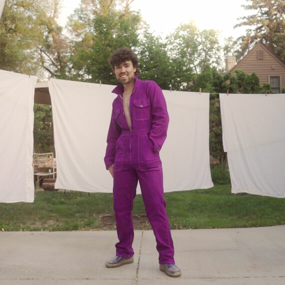 man wearing purple outfit