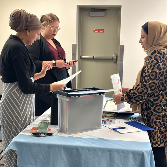 vendor and attendee at job fair event