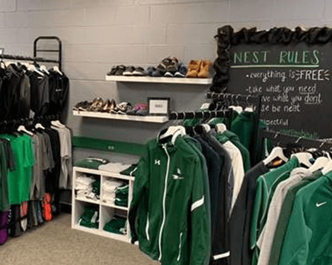 Photo of racks of clothing in the Nest store.