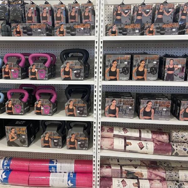 Photo of store shelving with weights and matts