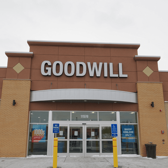 beige and brown exterior store with white "Goodwill" letters