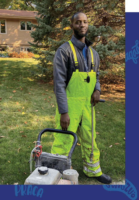 Photo of Fahad smiling at work.