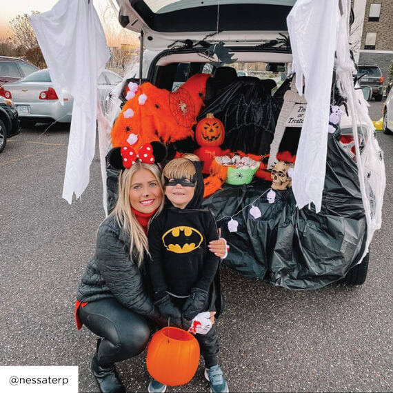 Photo of mom and kid dressed up in halloween costumes.