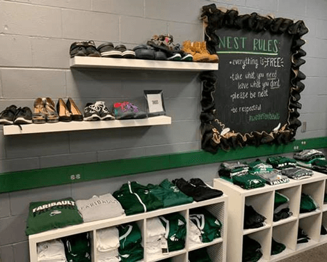 Photo inside the "The Nest" displaying shoe racks and tops.