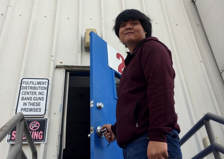 Brandon opens door leading to warehouse job