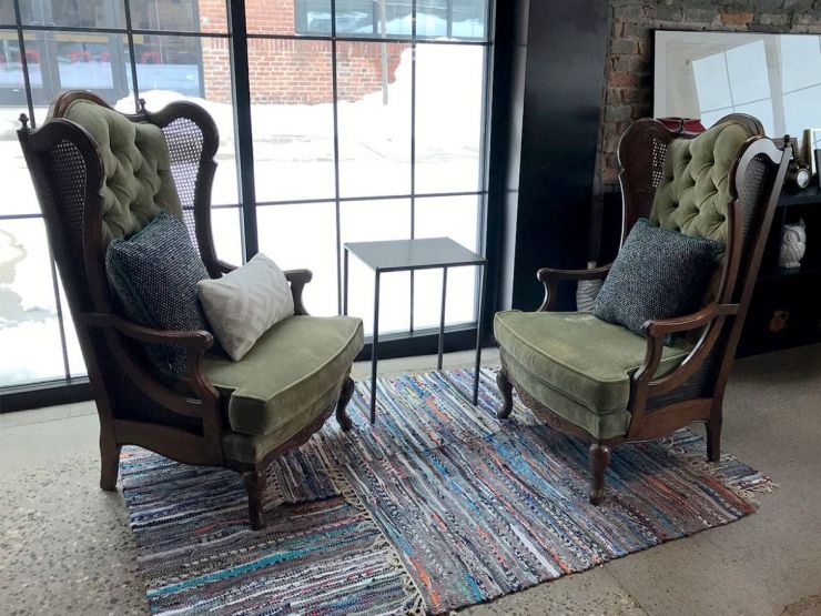 Vintage wingback chairs from Goodwill against a sunny window at Lake Monster