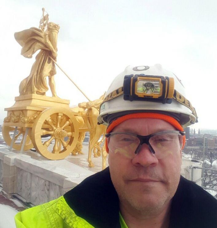 Construction participant Tim on the roof of the Minnesota Capitol