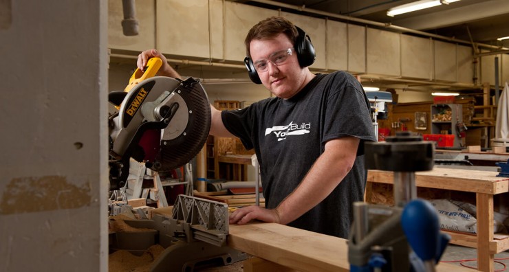 Photo of a student using a miter saw.