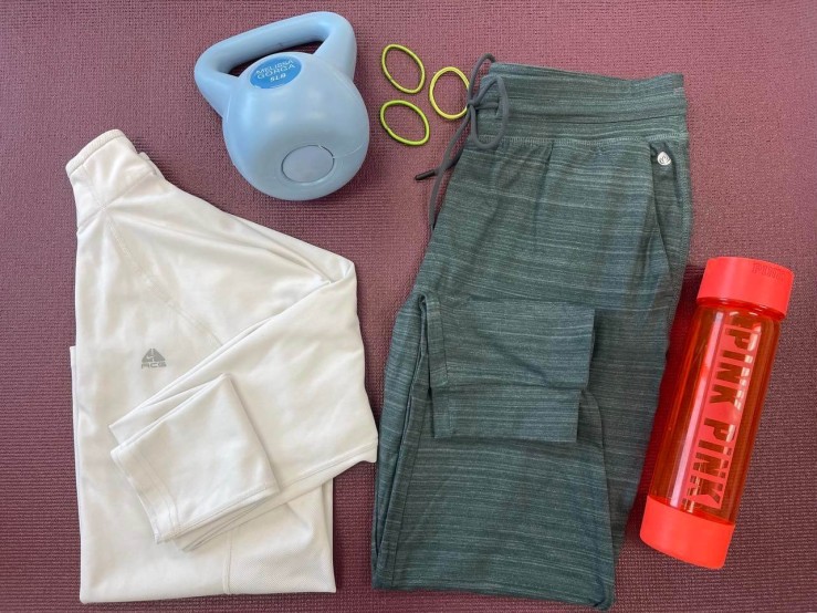photo of workout outfit, water bottle, weight and hair bands